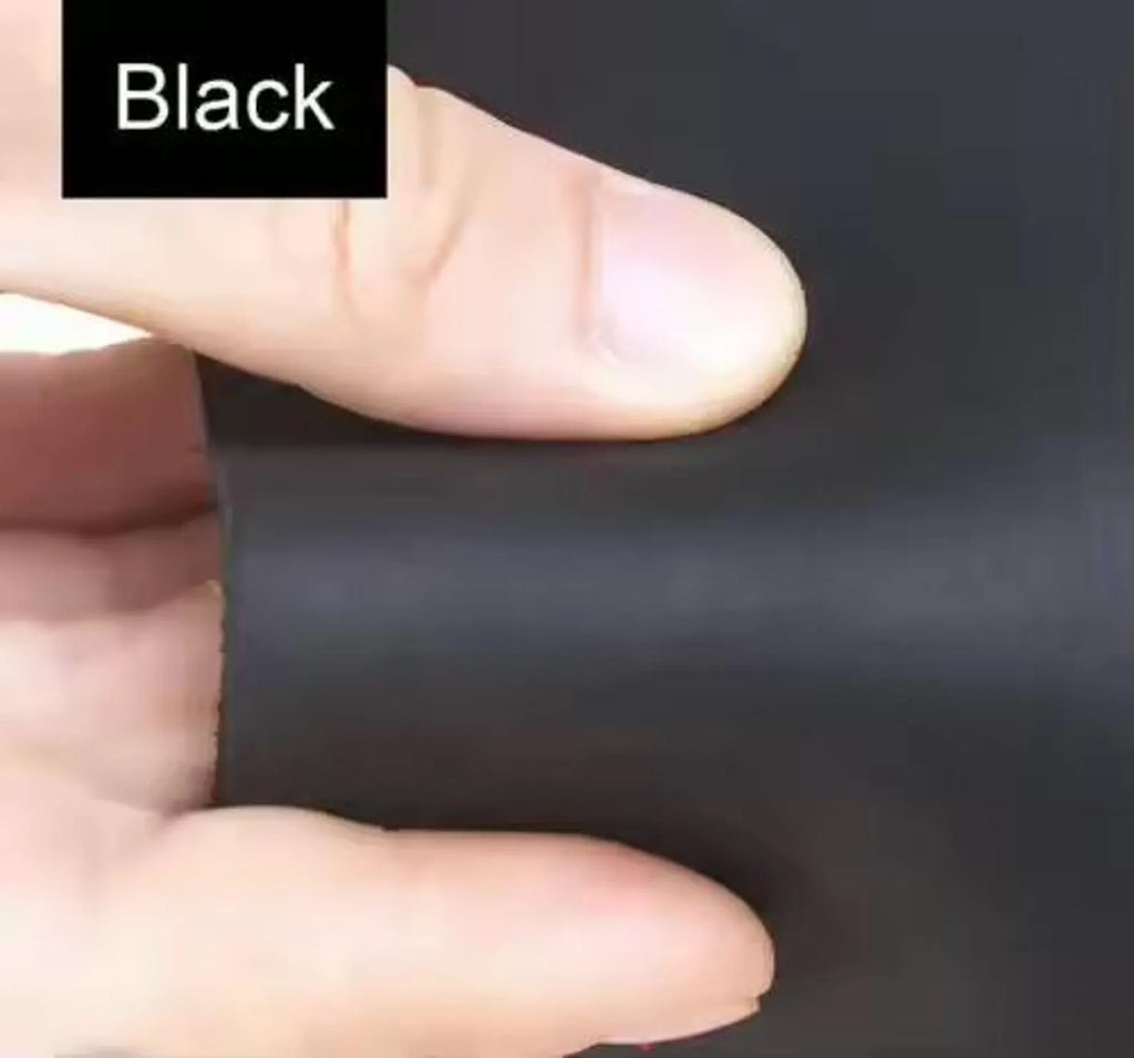 Hand holding a piece of black material with a finger pointing to it, labeled 'Black'.